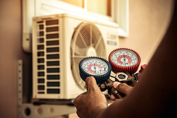 Professional Air Conditioning Service technician working in Round Lake, IL